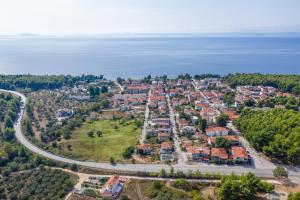 an aerial view of a city with the ocean at 4- you Family in Metamorfosi
