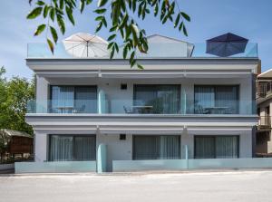 a building with umbrellas on top of it at 4- you Family in Metamorfosi
