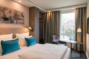 
Ein Bett oder Betten in einem Zimmer der Unterkunft Motel One Dresden - Palaisplatz
