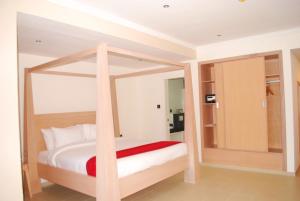 a bedroom with a canopy bed in a room at Best Western Plus Atlantic Hotel in Sekondi-Takoradi