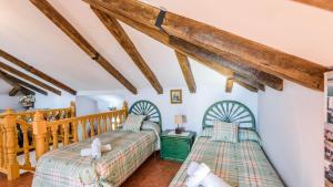 Posteľ alebo postele v izbe v ubytovaní Villa Riillo Casarabonela by Ruralidays + 37 fotografií