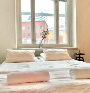 A bed or beds in a room at City Home Finland Ratina - Spacious Apartment with Own SAUNA and Great Location Next to Uros Live Arena