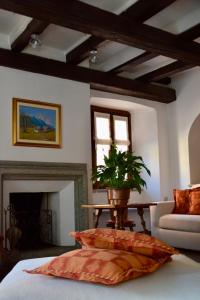 a bedroom with a table with a plant on it at La Ghirba in Santa Maria Maggiore