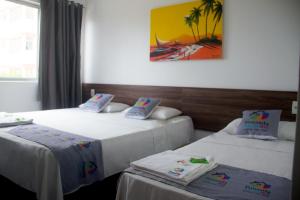 Postel nebo postele na pokoji v ubytování Pousada Arco Iris Fortaleza