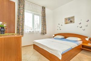Postel nebo postele na pokoji v ubytování BulgariaVilla - Villa Gardenia + 8 fotografií