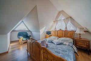 a bedroom with a bed and a dresser at Villa Nawrot in Zakopane