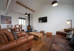 A seating area at The Shippon Luxury Holiday Let- Optional Hot Tub Extra Chg, Log Burner & Views