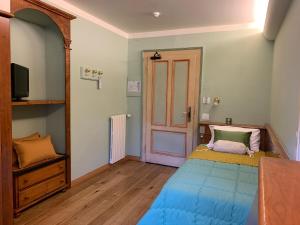 Postel nebo postele na pokoji v ubytování Hotel Serena Cortina
