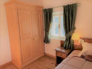 Postel nebo postele na pokoji v ubytování Hotel Serena Cortina