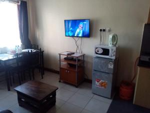 Kuchyň nebo kuchyňský kout v ubytování Kim Suites - Mvuli Studio Apartment