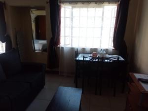 Posezení v ubytování Kim Suites - Mvuli Studio Apartment