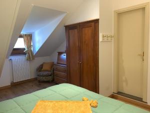 Postel nebo postele na pokoji v ubytování Hotel Serena Cortina