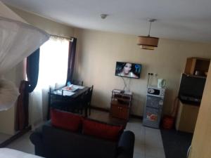 Kuchyň nebo kuchyňský kout v ubytování Kim Suites - Mvuli Studio Apartment