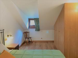 Postel nebo postele na pokoji v ubytování Hotel Serena Cortina