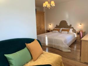 Postel nebo postele na pokoji v ubytování Hotel Serena Cortina
