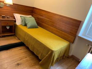 Postel nebo postele na pokoji v ubytování Hotel Serena Cortina