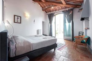 Postel nebo postele na pokoji v ubytování Poderi in Chianti