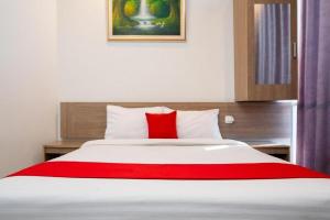 Postel nebo postele na pokoji v ubytování Hotel Domino