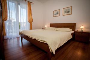 Posteľ alebo postele v izbe v ubytovaní Apartments Bogović