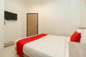 Postel nebo postele na pokoji v ubytování Hotel Domino