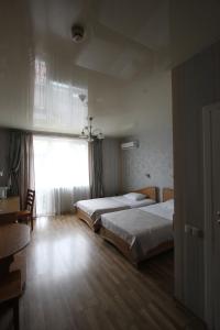 A bed or beds in a room at Готель ПАРК