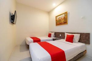 Tempat tidur dalam kamar di Hotel Domino