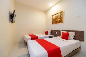 Postel nebo postele na pokoji v ubytování Hotel Domino