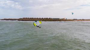 a person is windsurfing in the water on the ocean at Westpoint Dakhla in Dakhla