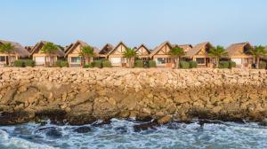 a row of houses next to the ocean at Westpoint Dakhla in Dakhla