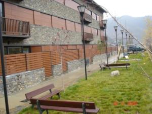 a group of benches in front of a building at Valencia de Aneu TP in Valencia de Aneu +3 photos