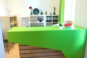 a green counter with a bowl of food on it at bestprice Hotel Aachen Hauptbahnhof in Aachen