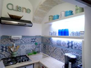 A kitchen or kitchenette at Charming sea-view house in Ostuni with terrace