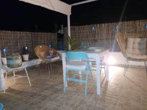 A seating area at Charming sea-view house in Ostuni with terrace