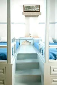 a room with some shelves in a room at Family House with Sea View in Patmos + Terrace in Patmos