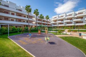 a playground in front of a apartment building at Spacious Apartment in Orihuela with Sea View in Playas de Orihuela
