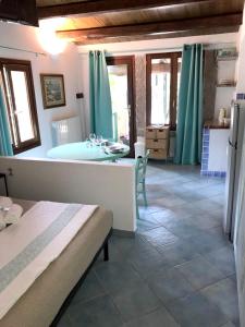 a bathroom with a bath tub and a sink at Charming Studio in Olbia with Garden, 35 m² in Porto Rotondo