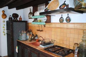 a kitchen with a stove and a counter top at Cosy House in La Sabinita with Mountain View in La Sabinita