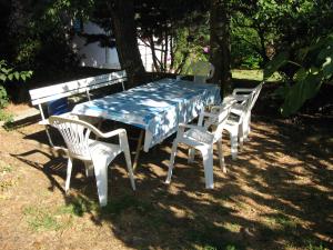a table and chairs with a blue and white table and chairssenalsenal at Charming House in Sveti Jakov, Mountain View in Sveti Jakov