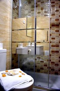a bathroom with a shower and a toilet and a sink at Spacious Villa with Private Pool in Oliveira de Azeméis in Oliveira de Azemeis