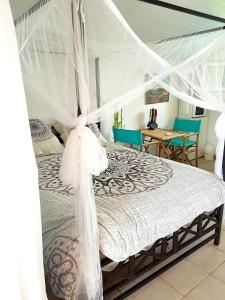 Postel nebo postele na pokoji v ubytování Appartement moderne à Le Lamentin avec piscine partagée - 20m²