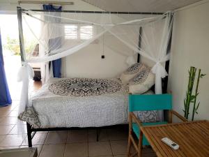 Voodi või voodid majutusasutuse Appartement moderne à Le Lamentin avec piscine partagée - 20m² toas