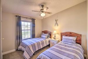 A bed or beds in a room at White River Fishing Escape with Deck and Patio!