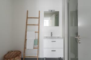 a bathroom with a ladder next to a sink at Royal Flats in Las Palmas de Gran Canaria