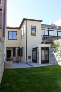 a large house with a lawn in front of it at Spacious House in Porto + Garden in Porto