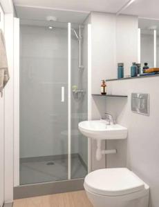 a bathroom with a shower and a toilet and a sink at Studio with city view furnished terrace and wifi at Moka in Moka