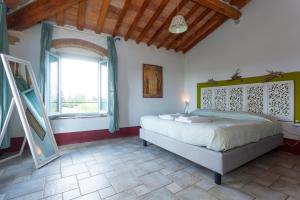 Postel nebo postele na pokoji v ubytování Poderi in Chianti
