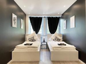 Ein Bett oder Betten in einem Zimmer der Unterkunft BLK Hostel