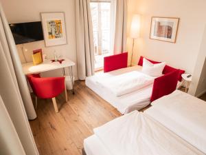 Letto o letti in una camera di Fuchsbräu