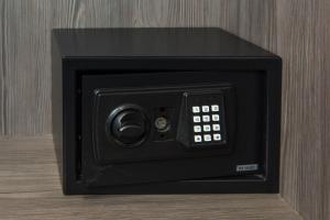 a black microwave oven with its door open at Eden Plaza Kensington in London