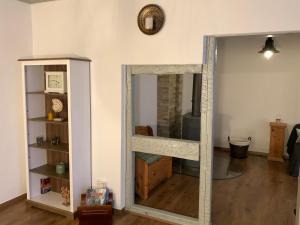a mirrored door in a room with a mirror at Villa Ammonit in Pottenstein +39 photos